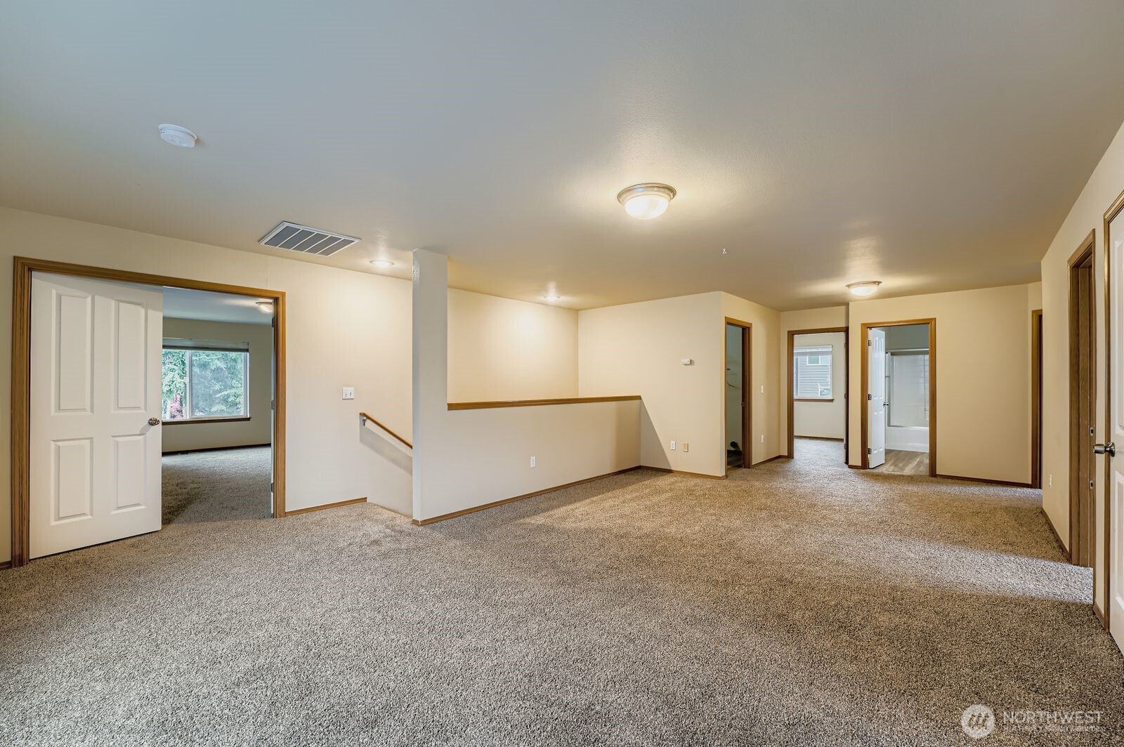 27030 228th Place Southeast Maple Valley, WA 98038 - Photo 28 of 36 an empty room with a cabinet and mirrors