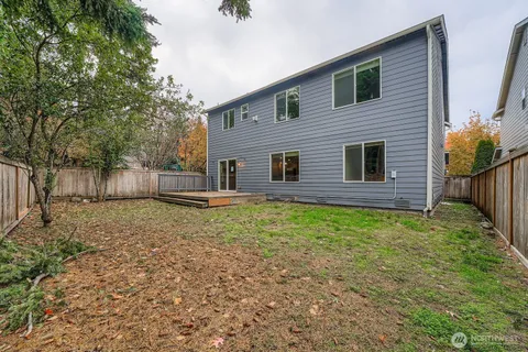 a backyard of a house with lots of green space
