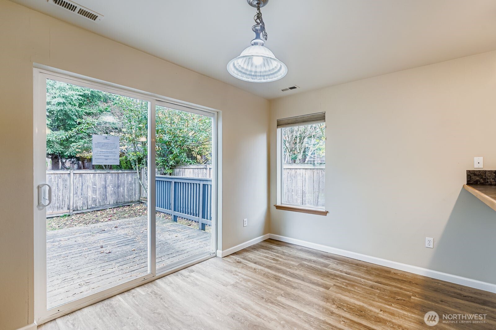 27030 228th Place Southeast Maple Valley, WA 98038 - Photo 8 of 36 a view of empty room with wooden floor and fan