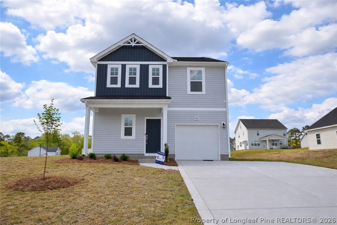 5405 Short Leaf Road Fayetteville, NC 28311 - Photo 1 of 29 a front view of a house with a yard and garage