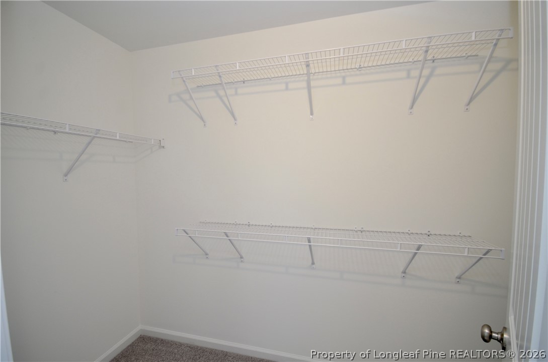 5405 Short Leaf Road Fayetteville, NC 28311 - Photo 21 of 29 a view of a room with racks on the wall