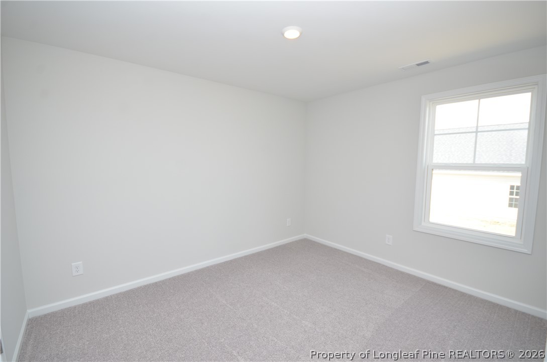 5405 Short Leaf Road Fayetteville, NC 28311 - Photo 23 of 29 an empty room with a window