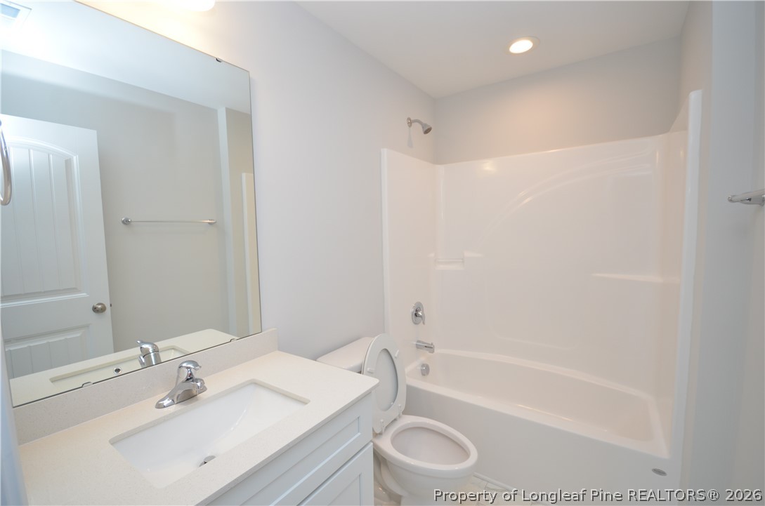 5405 Short Leaf Road Fayetteville, NC 28311 - Photo 25 of 29 a bathroom with a sink toilet and shower