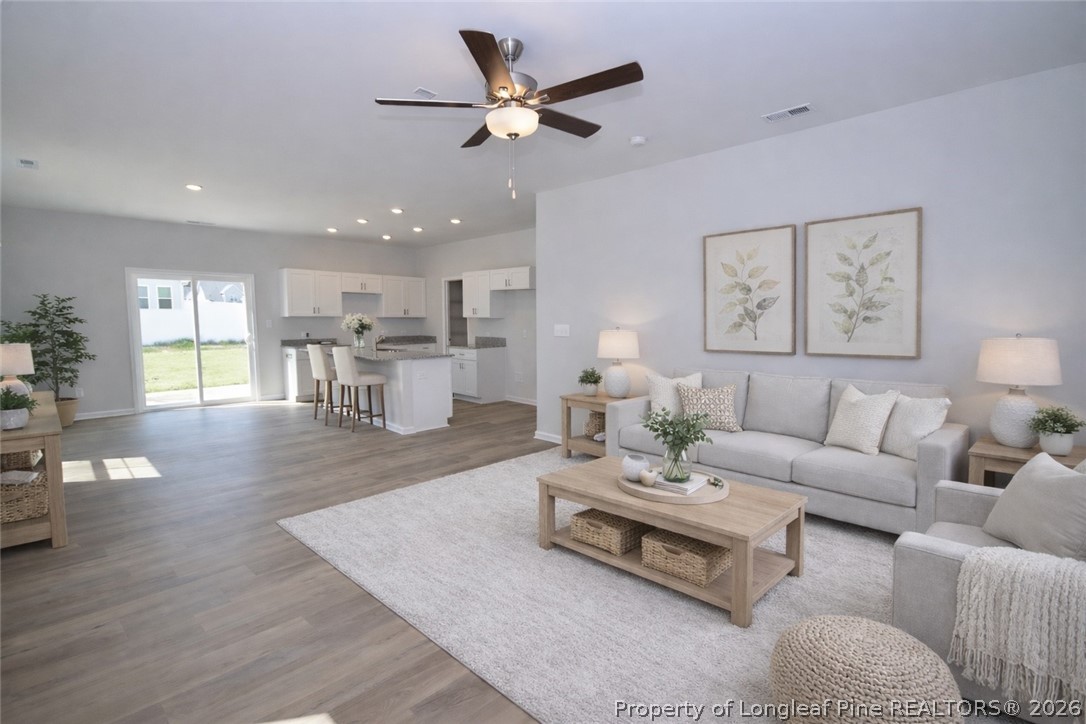 5405 Short Leaf Road Fayetteville, NC 28311 - Photo 3 of 29 a living room with furniture and a wooden floor