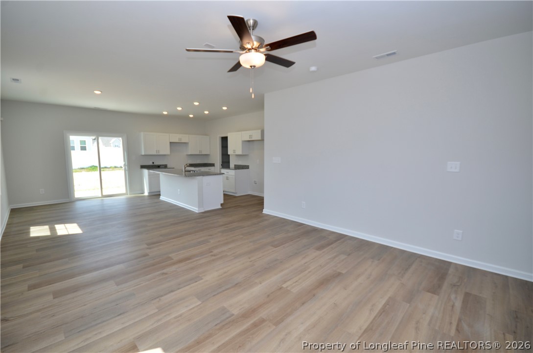5405 Short Leaf Road Fayetteville, NC 28311 - Photo 4 of 29 a view of a kitchen with a sink and a stove