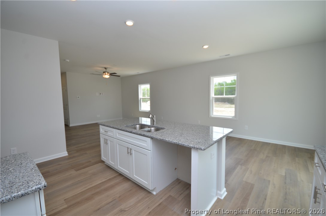 5405 Short Leaf Road Fayetteville, NC 28311 - Photo 8 of 29 a view with granite countertop furniture wooden floor and a window