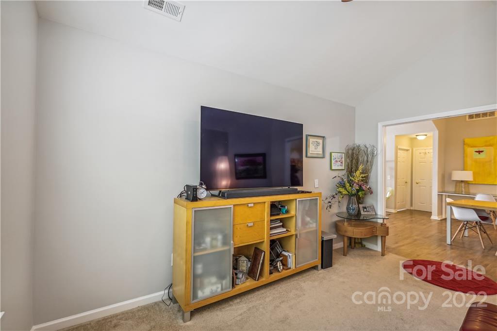 860 Ledgestone Court Tega Cay, SC 29708 - Photo 19 of 37 a living room with furniture and a flat screen tv