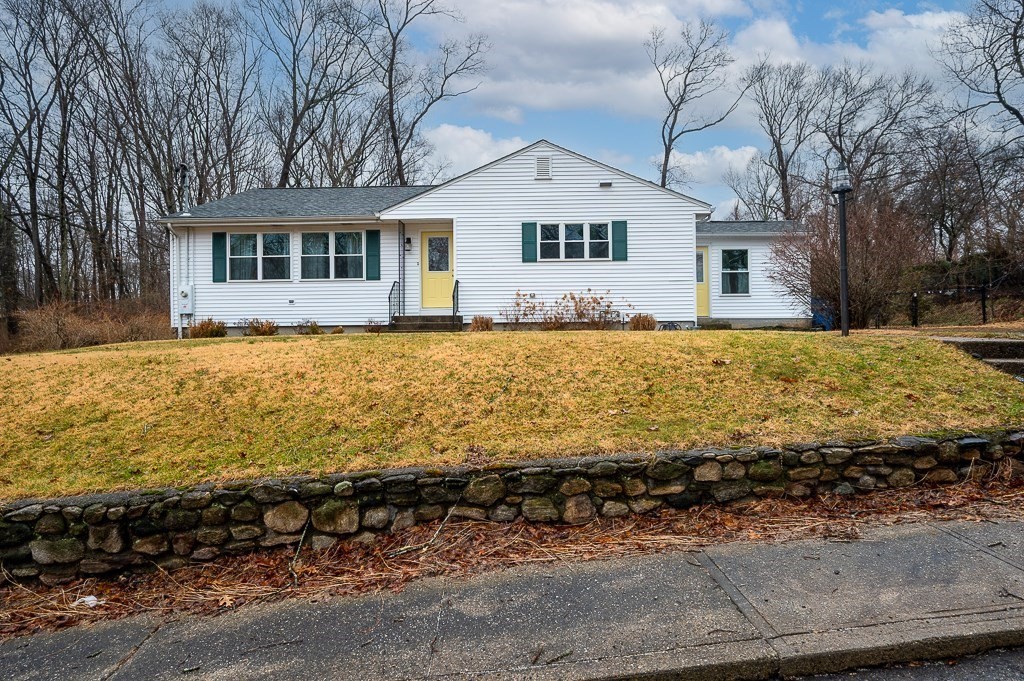 26 Prospect Street Blackstone, MA 01504 - Photo 1 of 41 a front view of a house with a yard