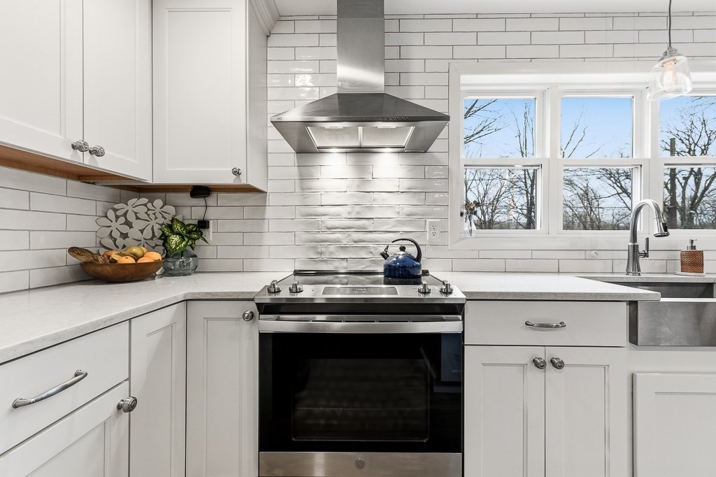 26 Prospect Street Blackstone, MA 01504 - Photo 11 of 41 a kitchen with a sink and cabinets