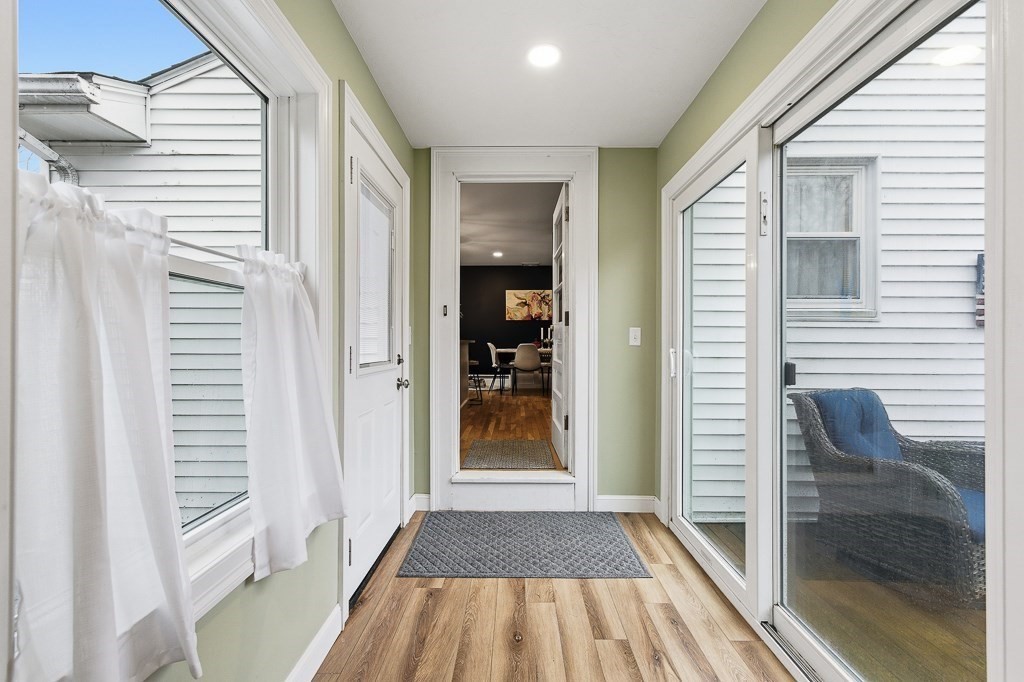 26 Prospect Street Blackstone, MA 01504 - Photo 26 of 41 a view of a hallway with wooden floor and dining room