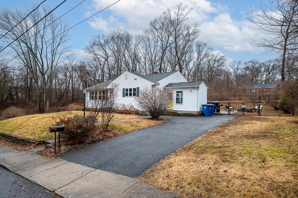 26 Prospect Street Blackstone, MA 01504 - Photo 3 of 41 a front view of a house with a yard and garage