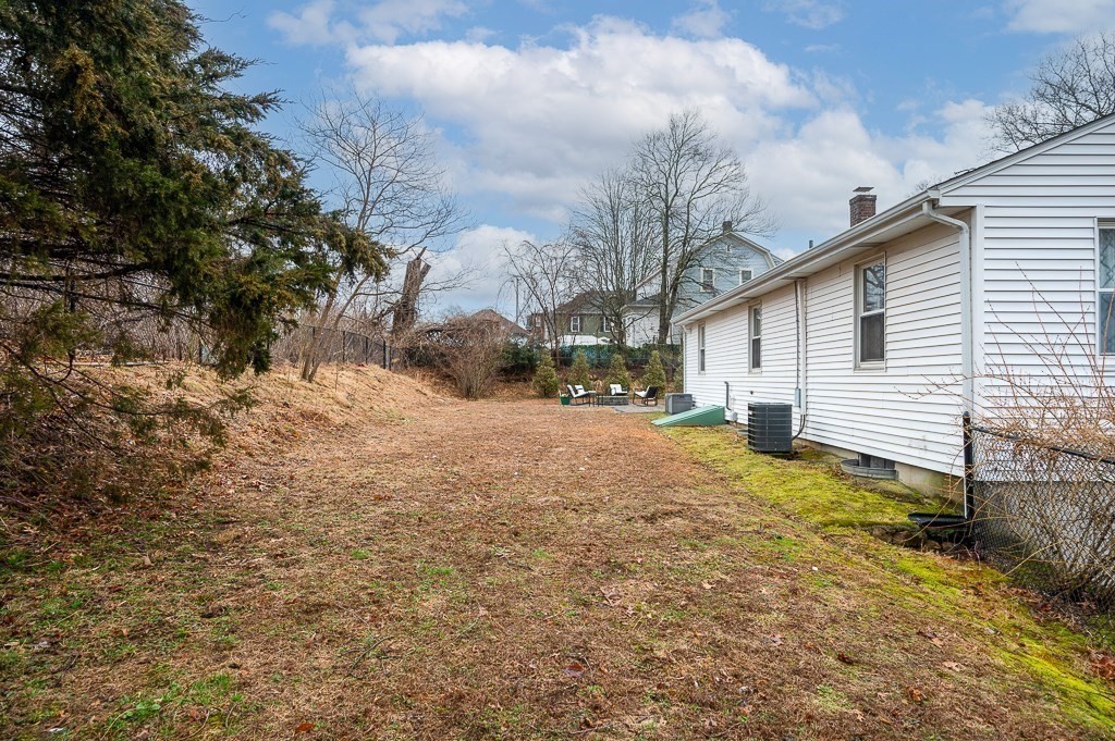 26 Prospect Street Blackstone, MA 01504 - Photo 36 of 41 a backyard of a house with large trees