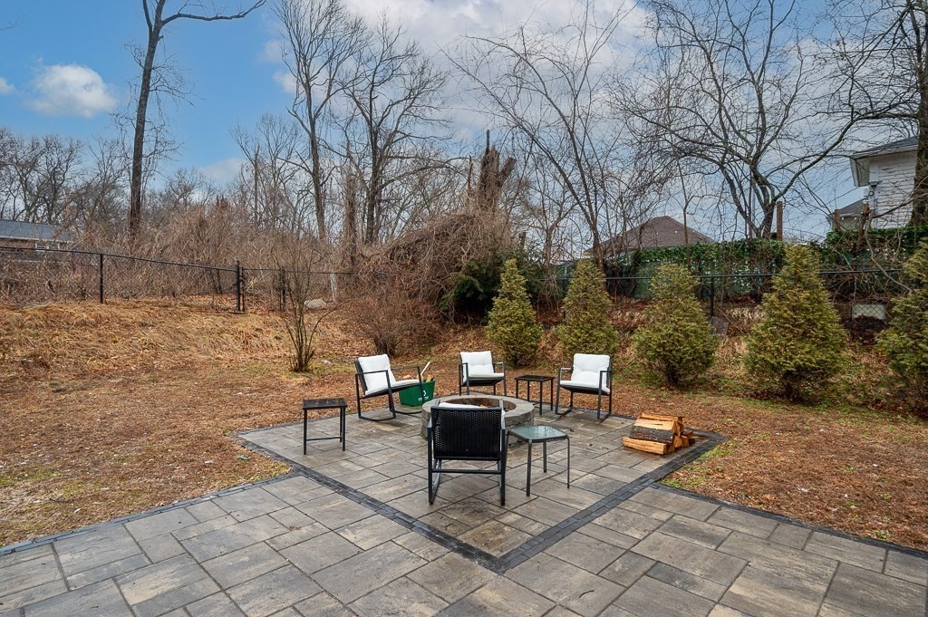26 Prospect Street Blackstone, MA 01504 - Photo 40 of 41 a backyard of a house with outdoor seating