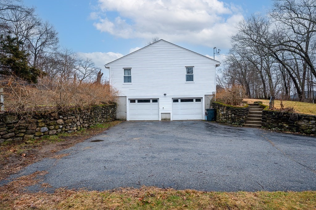 26 Prospect Street Blackstone, MA 01504 - Photo 4 of 41 a view of a house with backyard and trees
