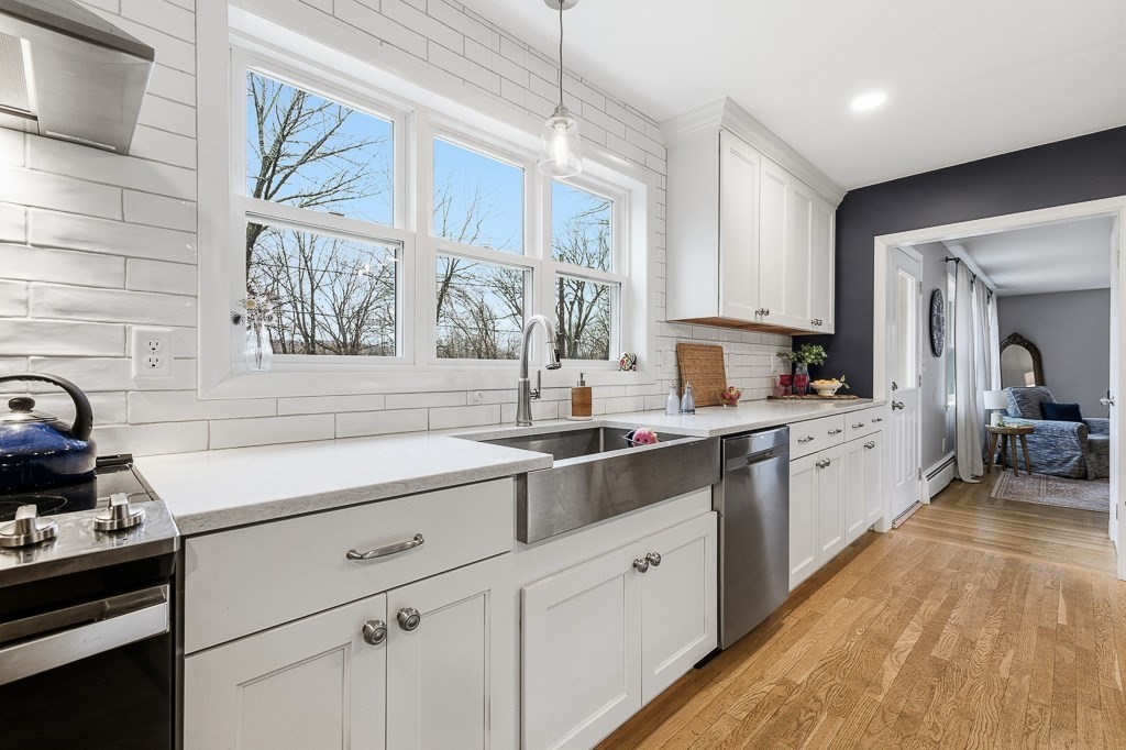 26 Prospect Street Blackstone, MA 01504 - Photo 9 of 41 a kitchen with a sink stove and cabinets