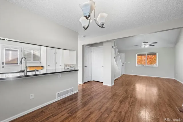 a view of kitchen with wooden floor and window