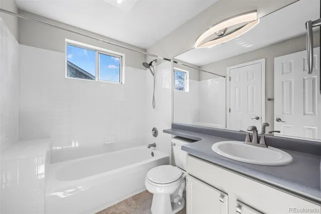 a bathroom with a sink a toilet and a bathtub