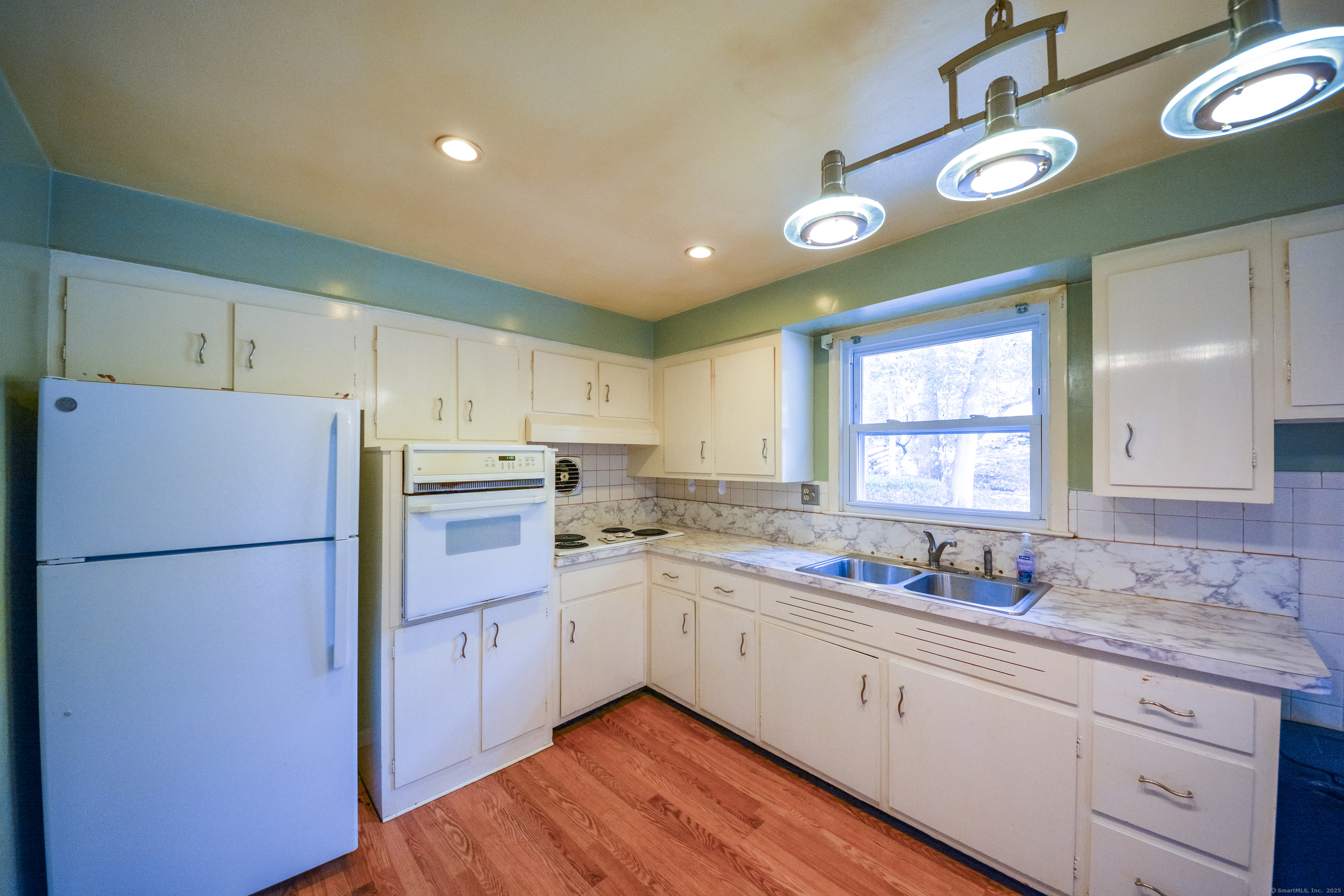 291 Frenchtown Road Bridgeport, CT 06606 - Photo 12 of 40 a kitchen with a refrigerator a sink dishwasher and a refrigerator