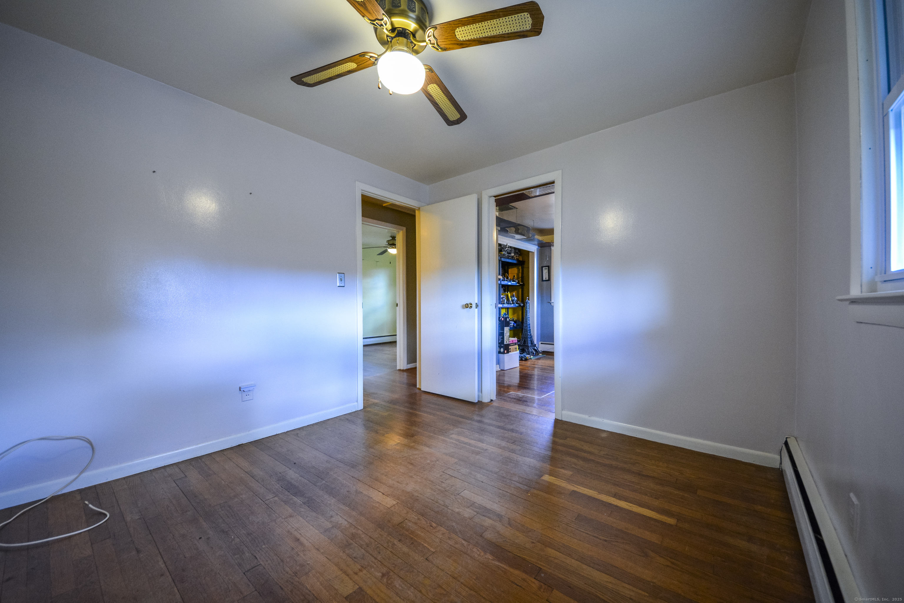 291 Frenchtown Road Bridgeport, CT 06606 - Photo 18 of 40 wooden floor in an empty room with a window