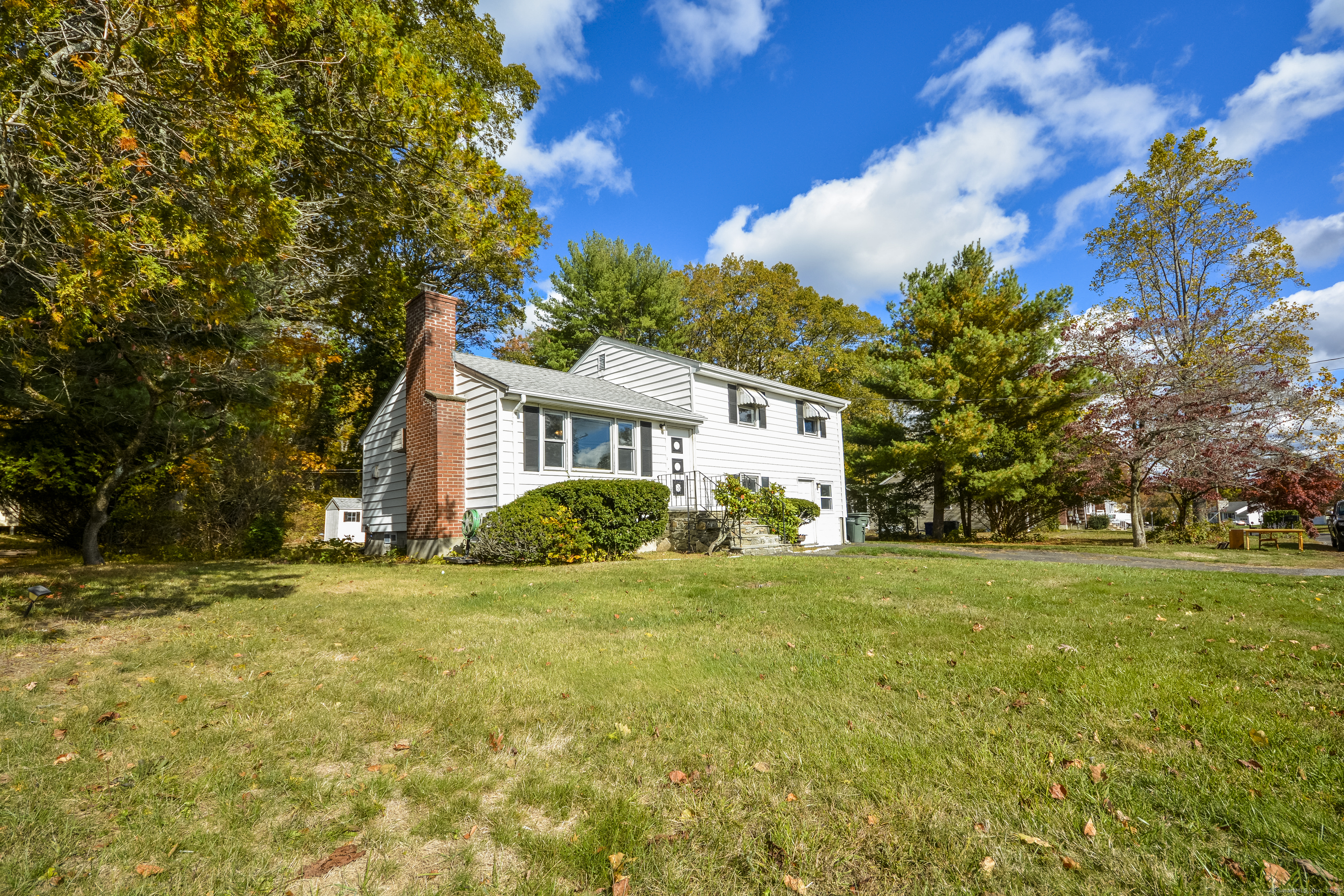 291 Frenchtown Road Bridgeport, CT 06606 - Photo 2 of 40 a view of a house with a big yard and palm trees