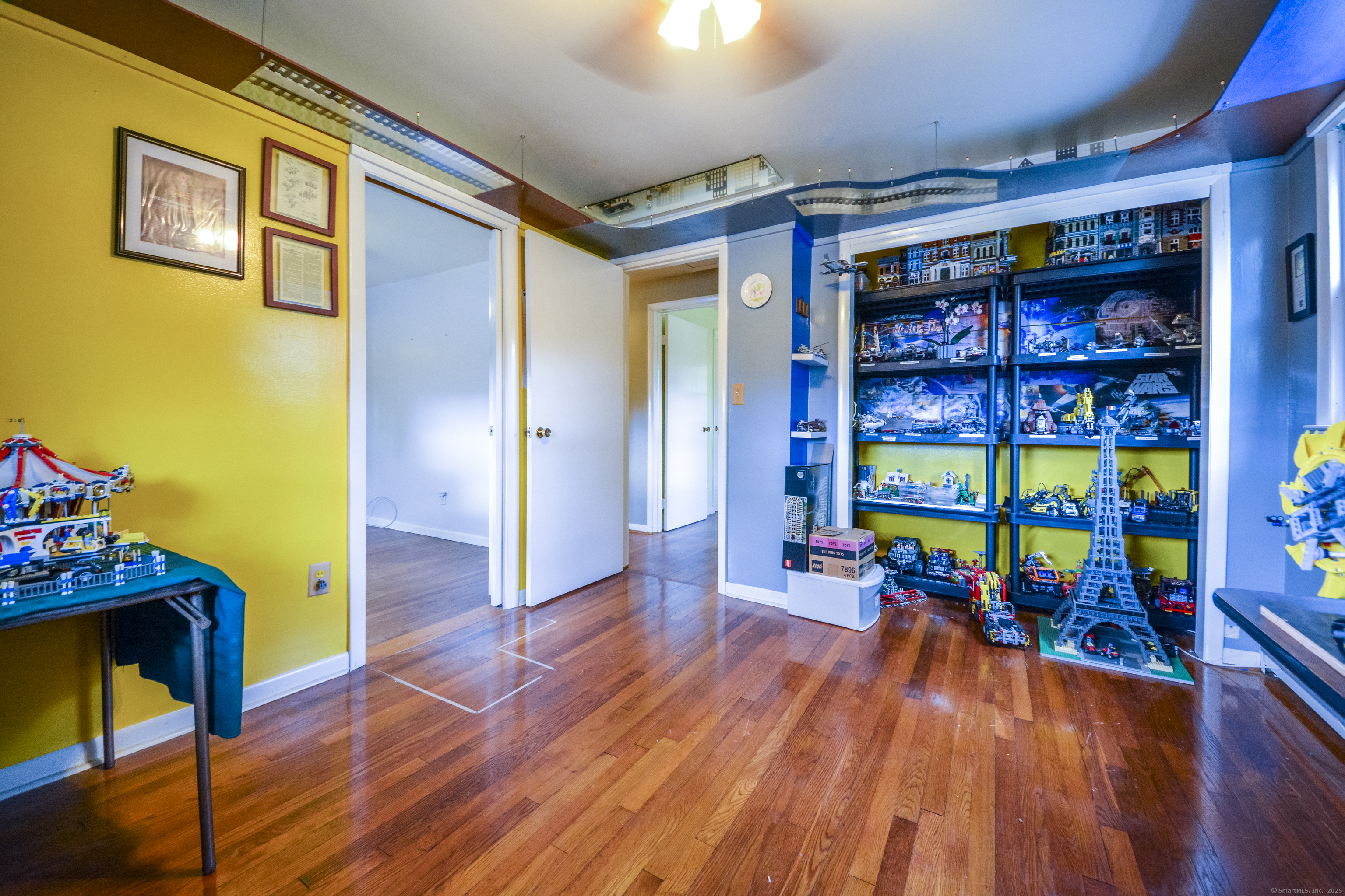 291 Frenchtown Road Bridgeport, CT 06606 - Photo 22 of 40 a view of a hallway with wooden floor and furniture