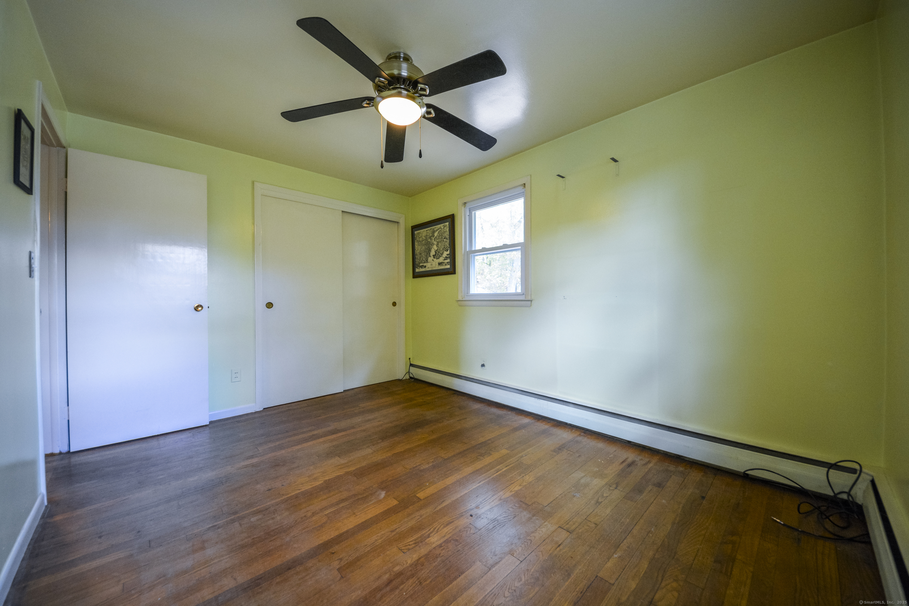 291 Frenchtown Road Bridgeport, CT 06606 - Photo 27 of 40 a view of an empty room with wooden floor