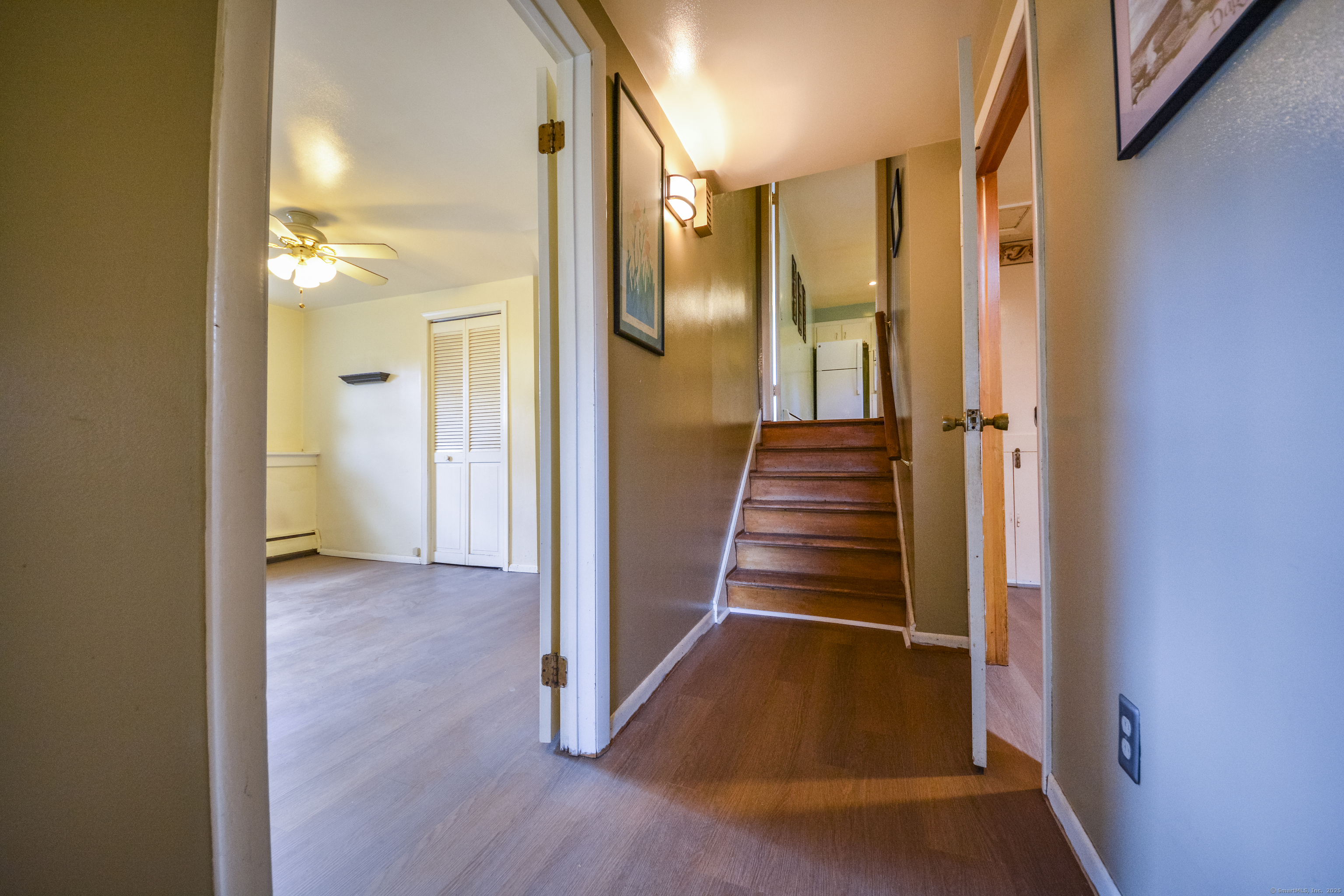291 Frenchtown Road Bridgeport, CT 06606 - Photo 28 of 40 a view of a hallway with wooden floor and staircase