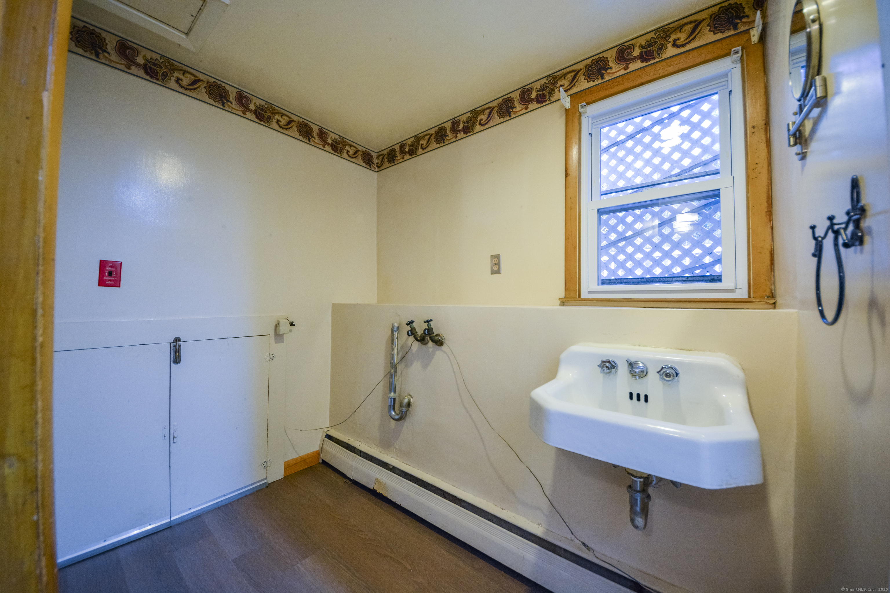291 Frenchtown Road Bridgeport, CT 06606 - Photo 30 of 40 a bathroom with a sink and a mirror
