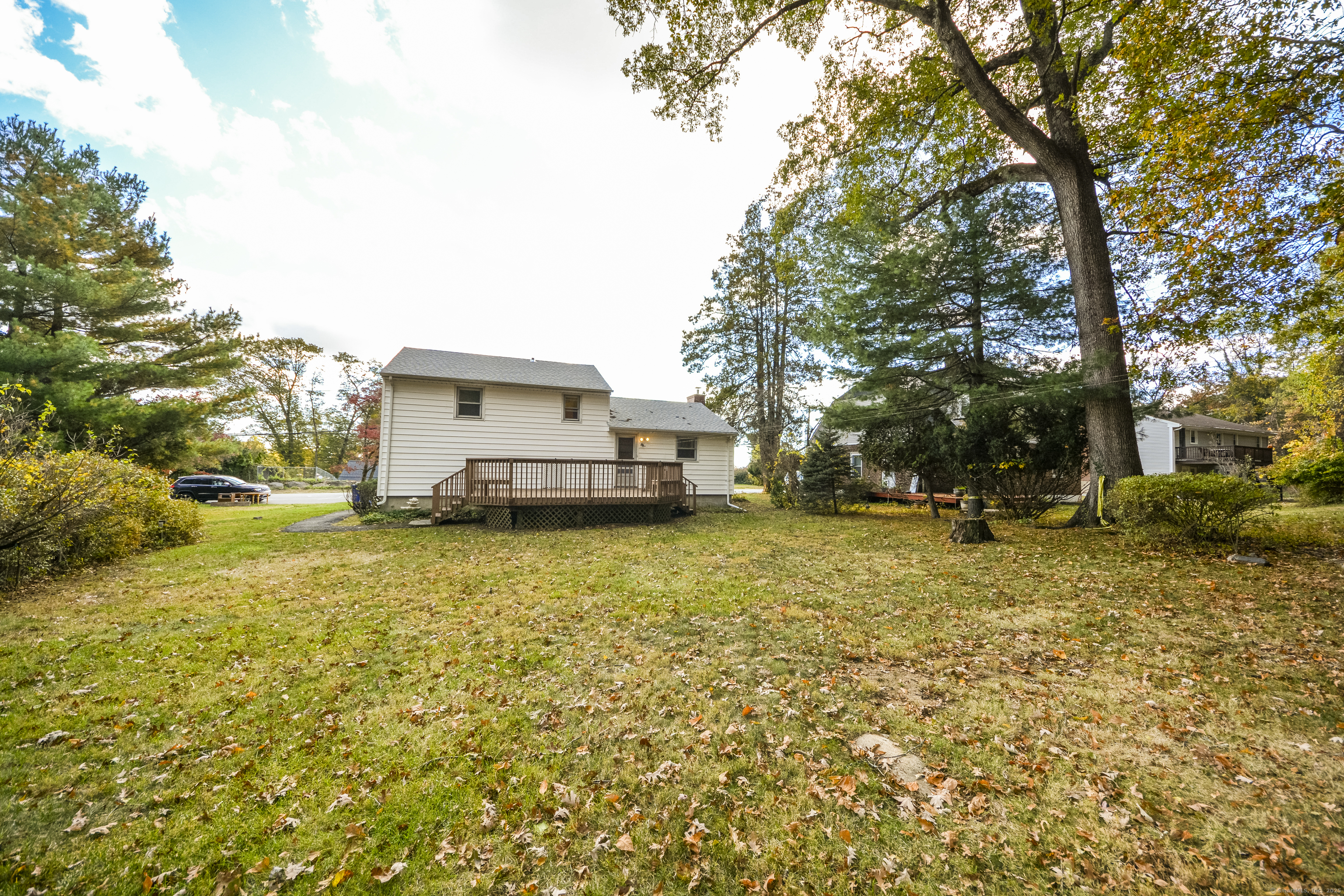 291 Frenchtown Road Bridgeport, CT 06606 - Photo 5 of 40 a yellow house with trees in front of it