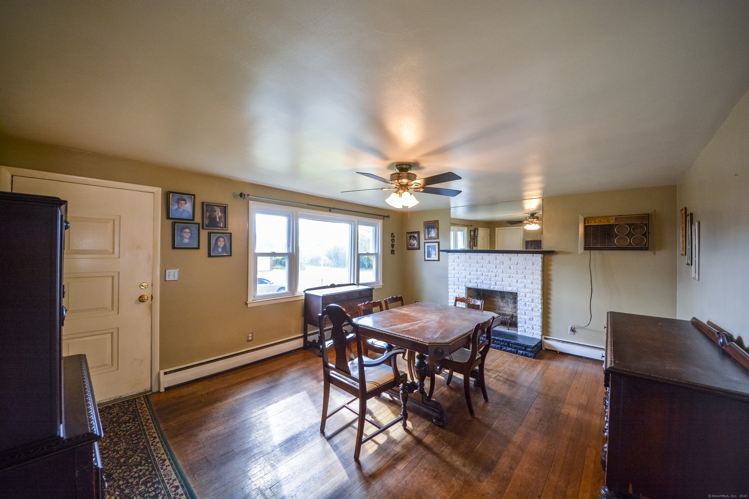 291 Frenchtown Road Bridgeport, CT 06606 - Photo 9 of 40 a view of a dining room with furniture and wooden floor