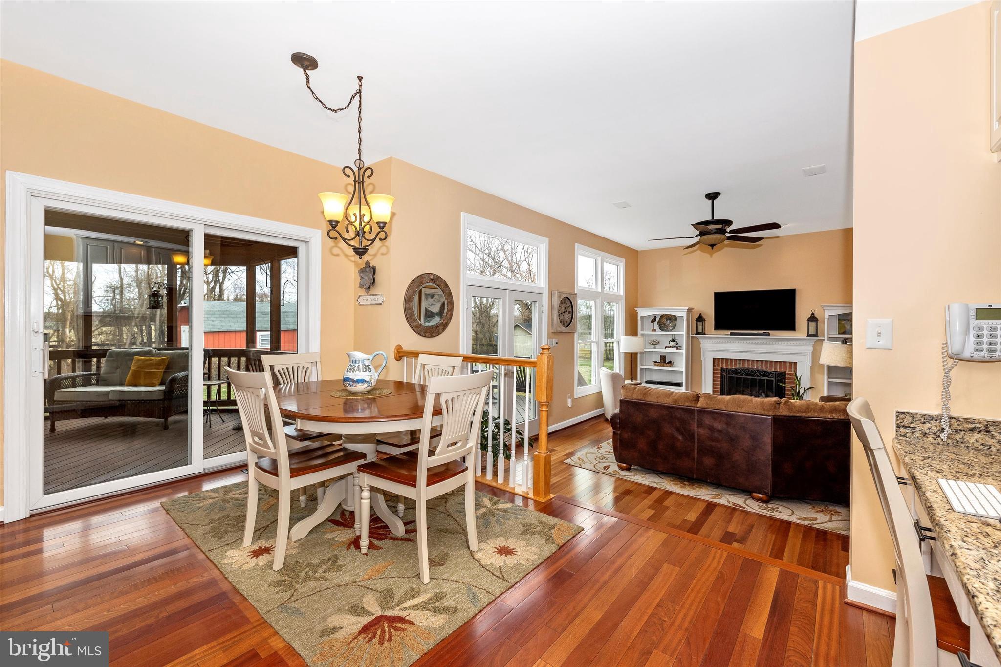 17918 Hickman Street Poolesville, MD 20837 - Photo 18 of 96 a view of a dining room with furniture wooden floor and chandelier