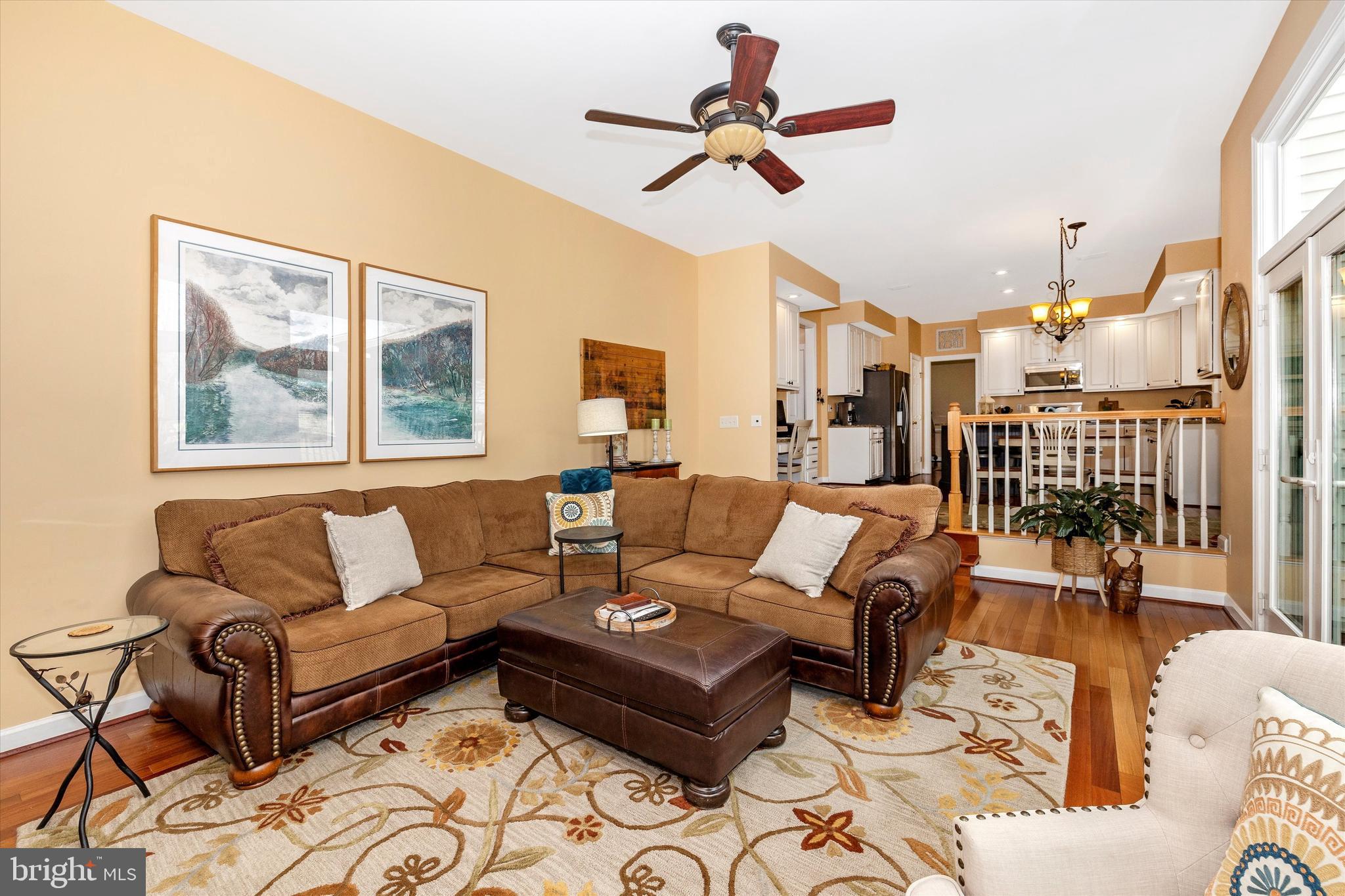 17918 Hickman Street Poolesville, MD 20837 - Photo 21 of 96 a living room with furniture ceiling fan and a window
