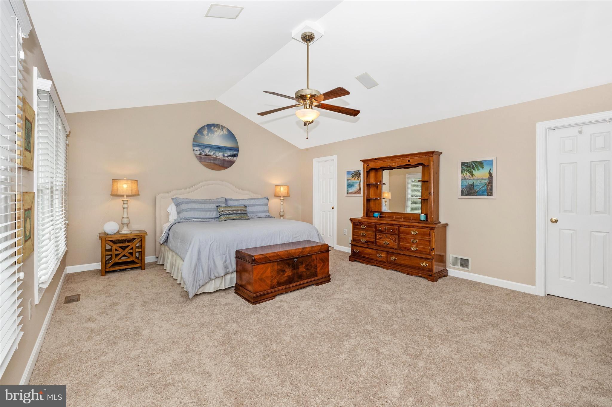 17918 Hickman Street Poolesville, MD 20837 - Photo 27 of 96 a bedroom with a bed and ceiling chandelier