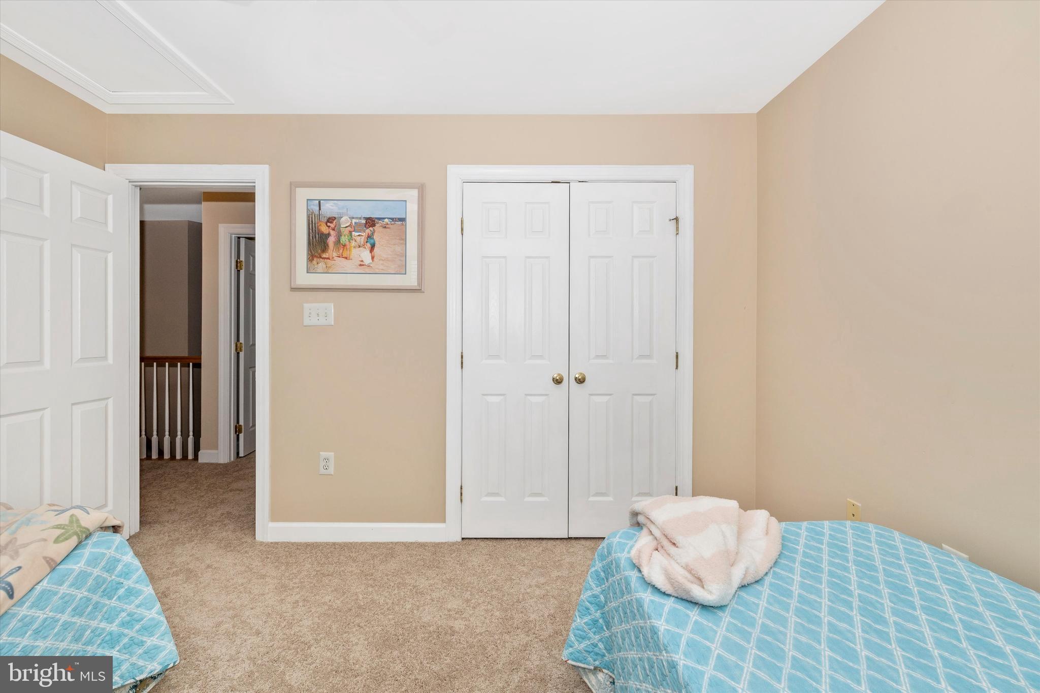 17918 Hickman Street Poolesville, MD 20837 - Photo 38 of 96 a view of a bedroom with wooden floor and bathroom