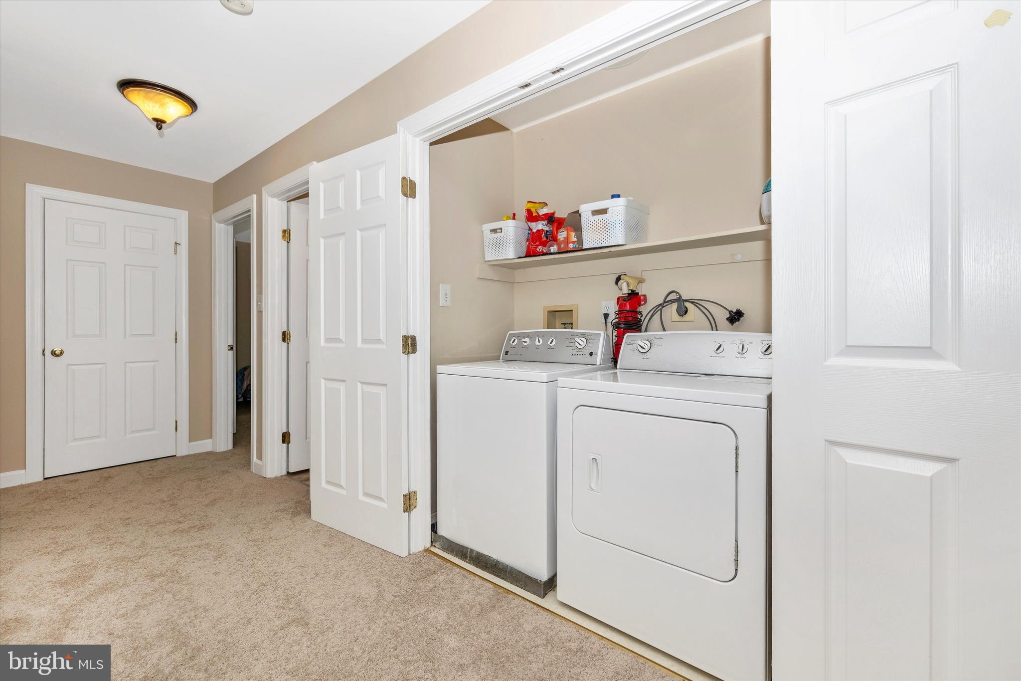 17918 Hickman Street Poolesville, MD 20837 - Photo 40 of 96 a view of storage and utility room with washer and dryer