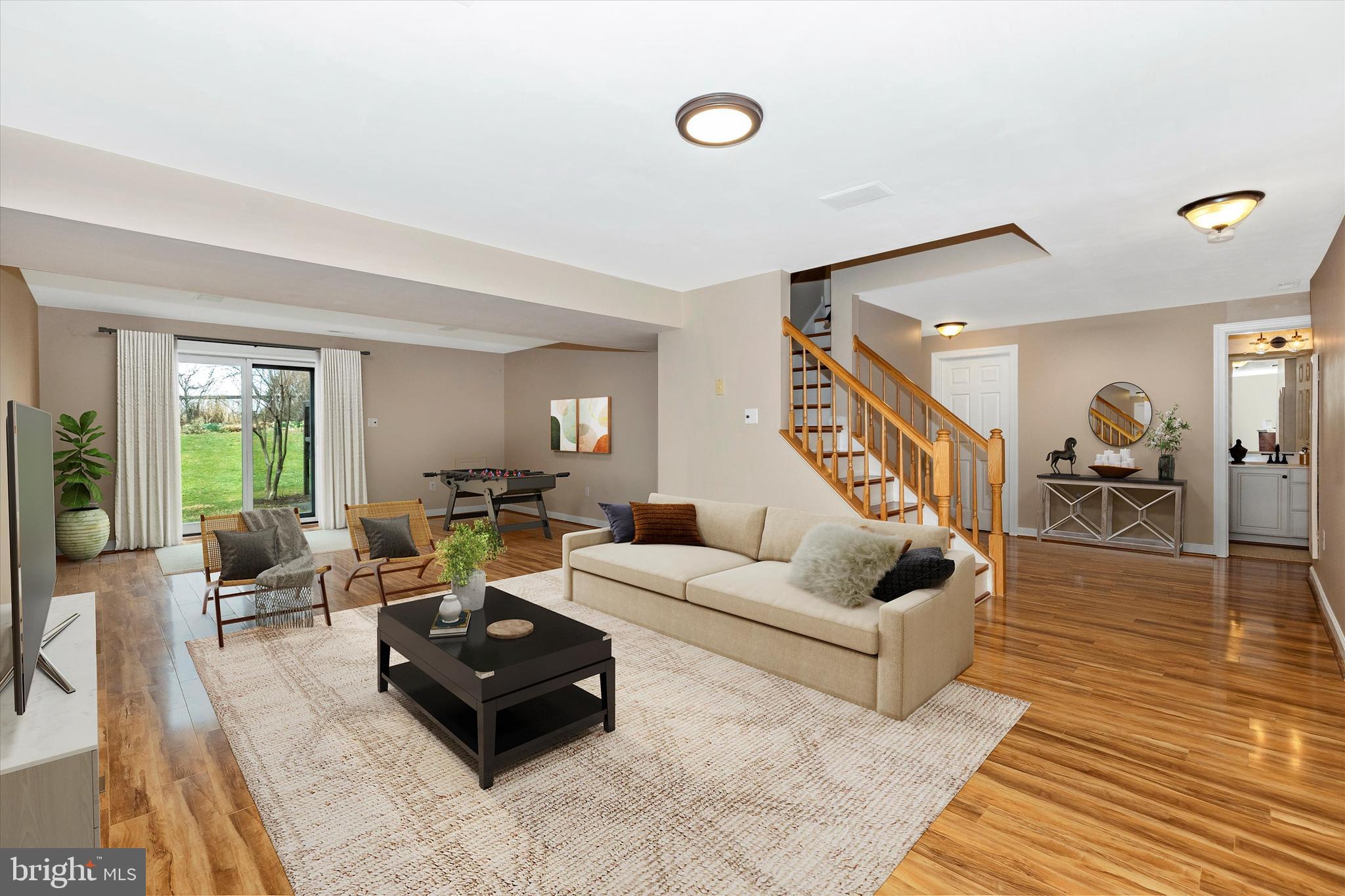 17918 Hickman Street Poolesville, MD 20837 - Photo 42 of 96 a living room with furniture and wooden floor
