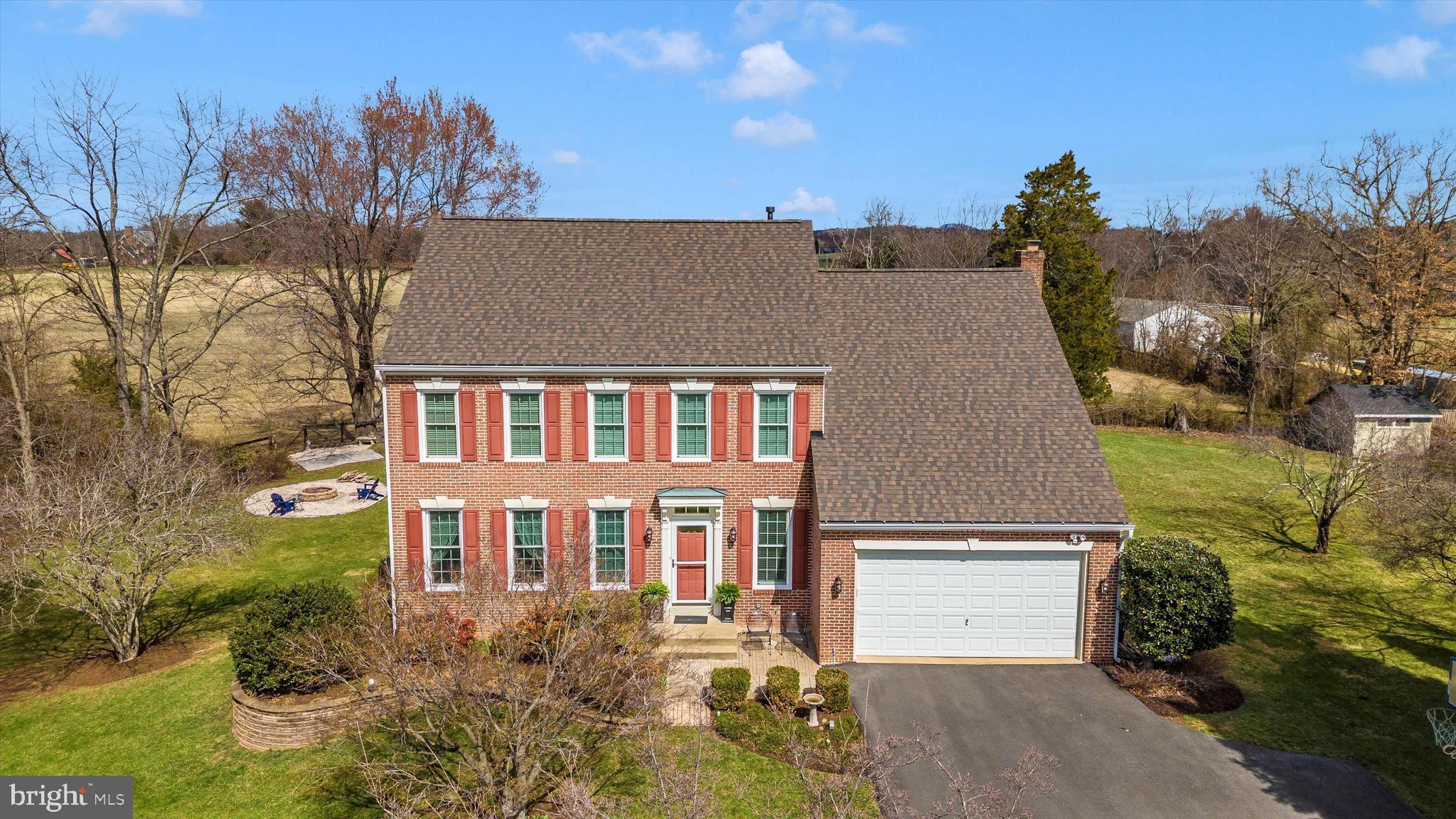 17918 Hickman Street Poolesville, MD 20837 - Photo 49 of 96 aerial view of a house with a yard and a garage