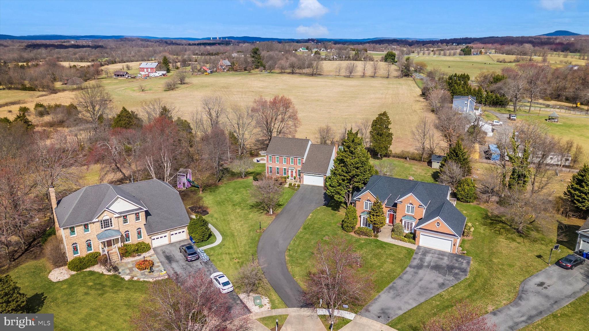 17918 Hickman Street Poolesville, MD 20837 - Photo 59 of 96 an aerial view of residential houses with outdoor space and swimming pool