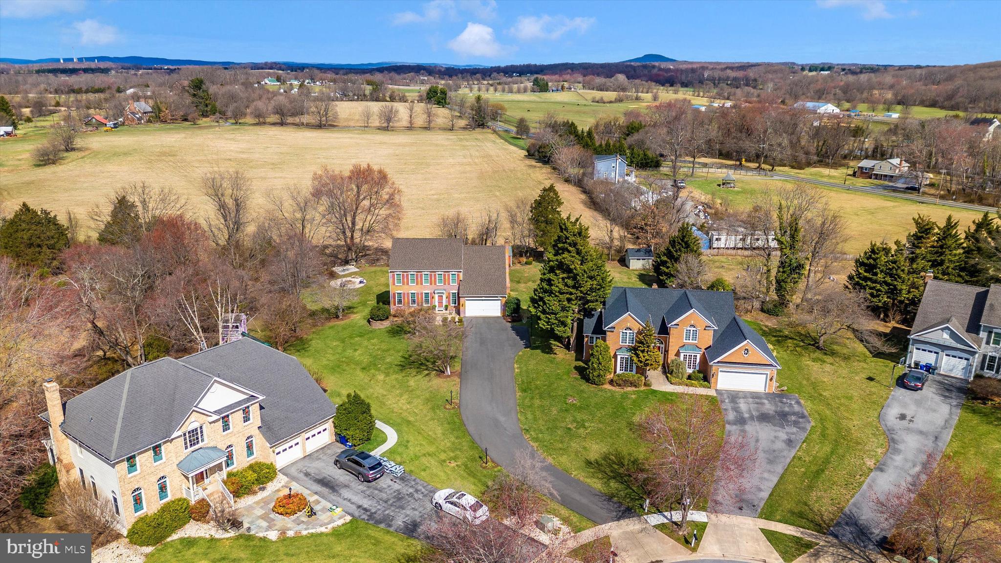 17918 Hickman Street Poolesville, MD 20837 - Photo 60 of 96 an aerial view of residential houses with outdoor space and swimming pool