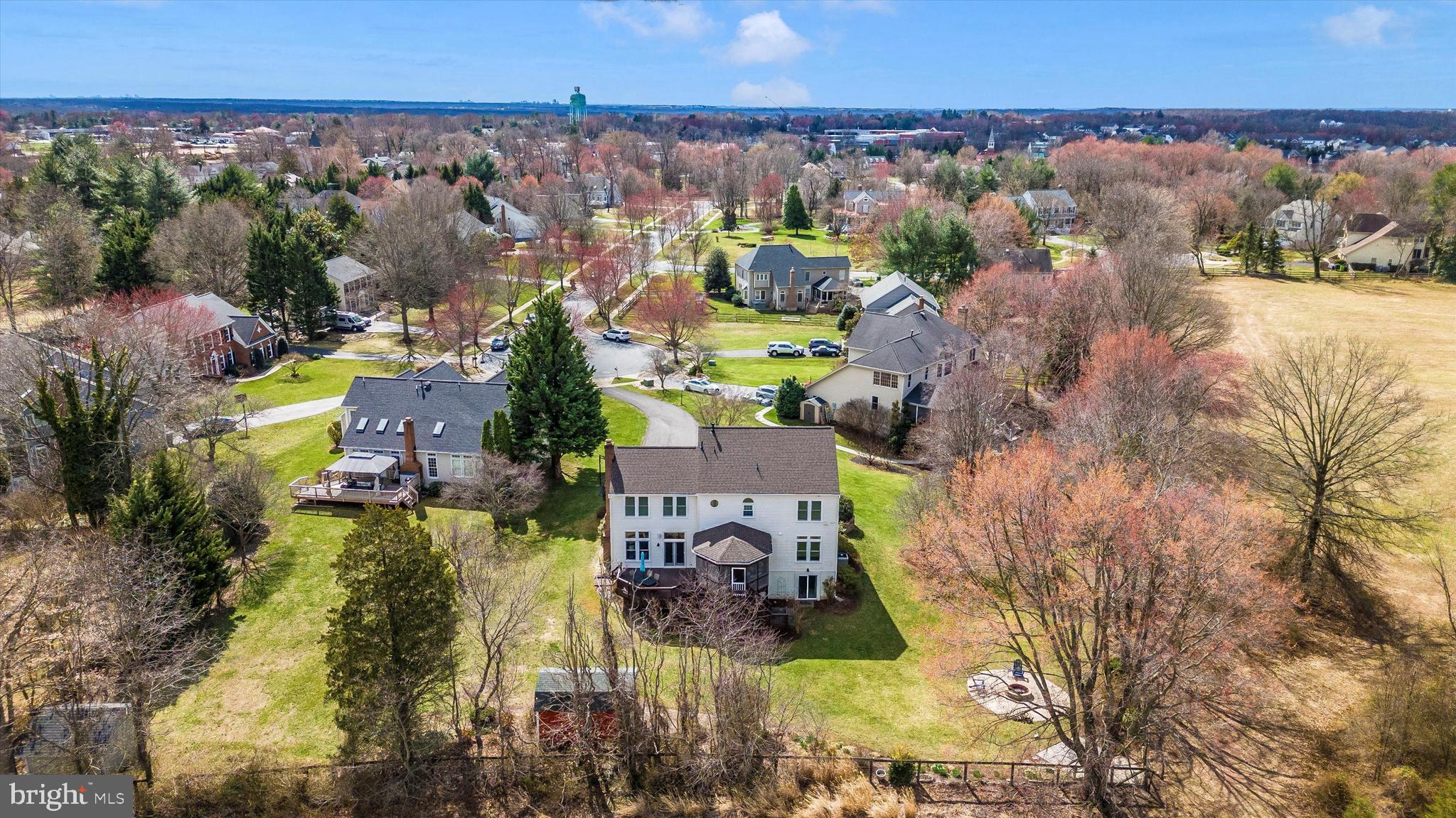17918 Hickman Street Poolesville, MD 20837 - Photo 64 of 96 an aerial view of residential houses with outdoor space and swimming pool