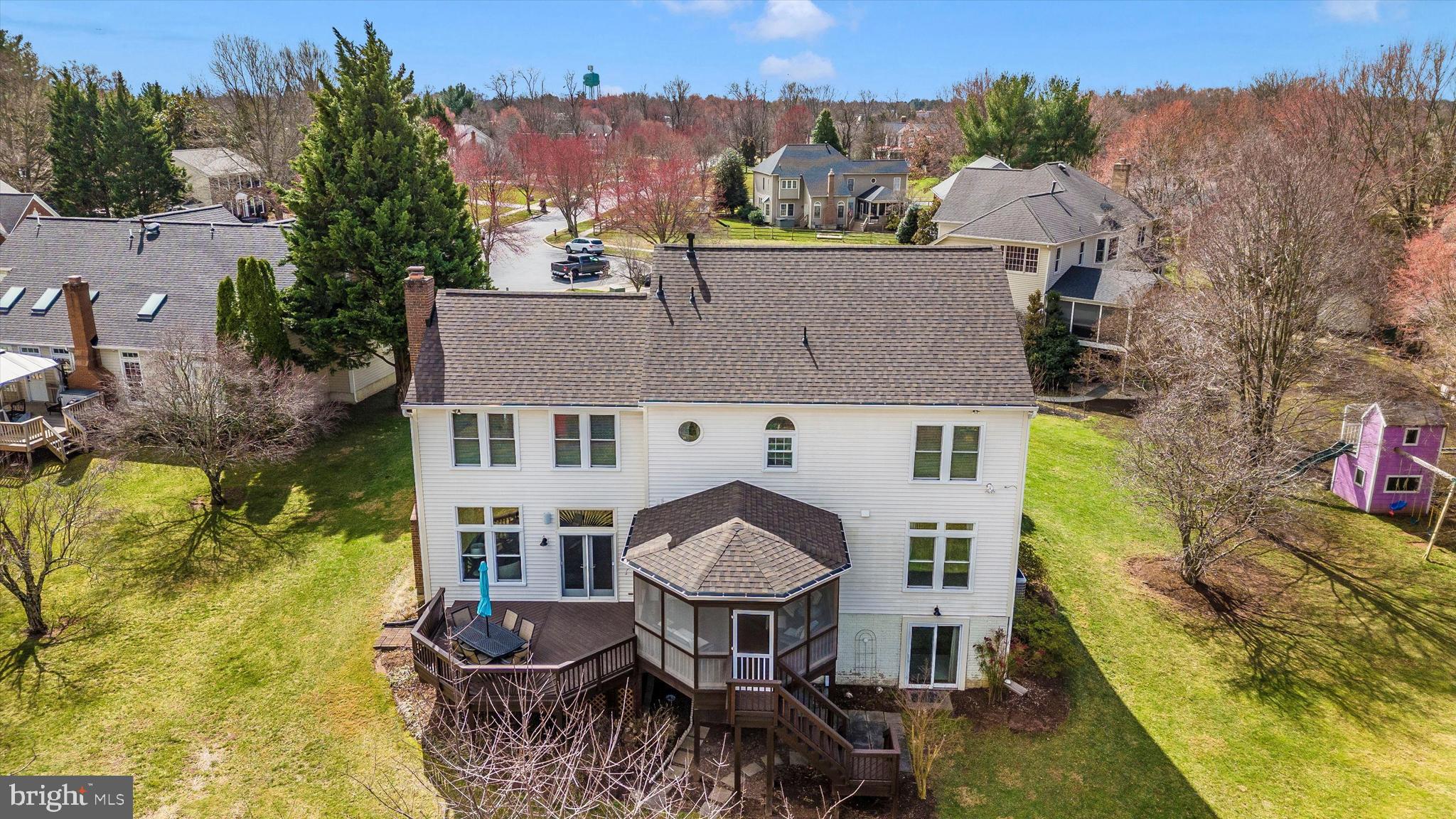 17918 Hickman Street Poolesville, MD 20837 - Photo 65 of 96 an aerial view of a house with table and chairs