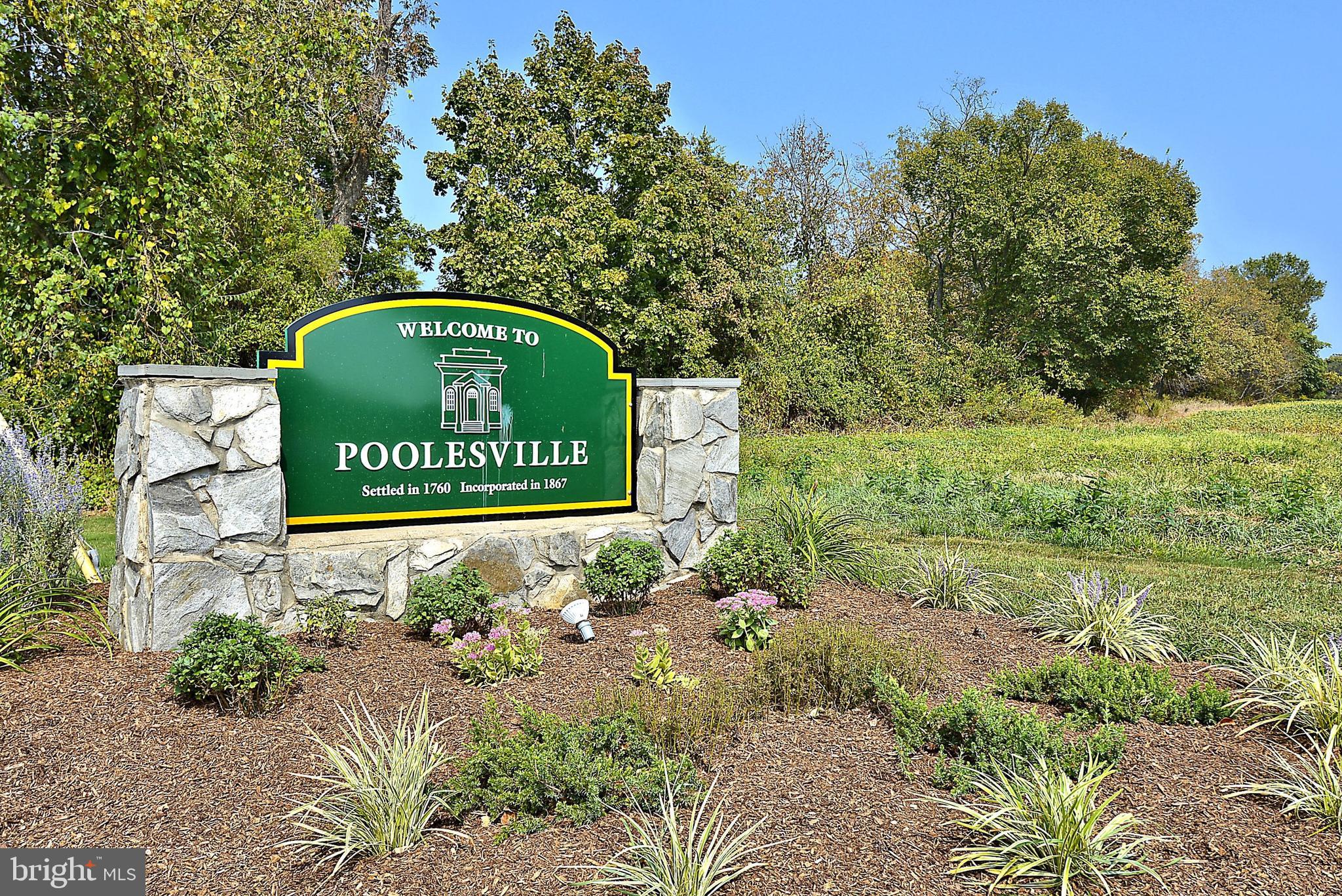 17918 Hickman Street Poolesville, MD 20837 - Photo 70 of 96 a sign of golf club on a wall under a tree