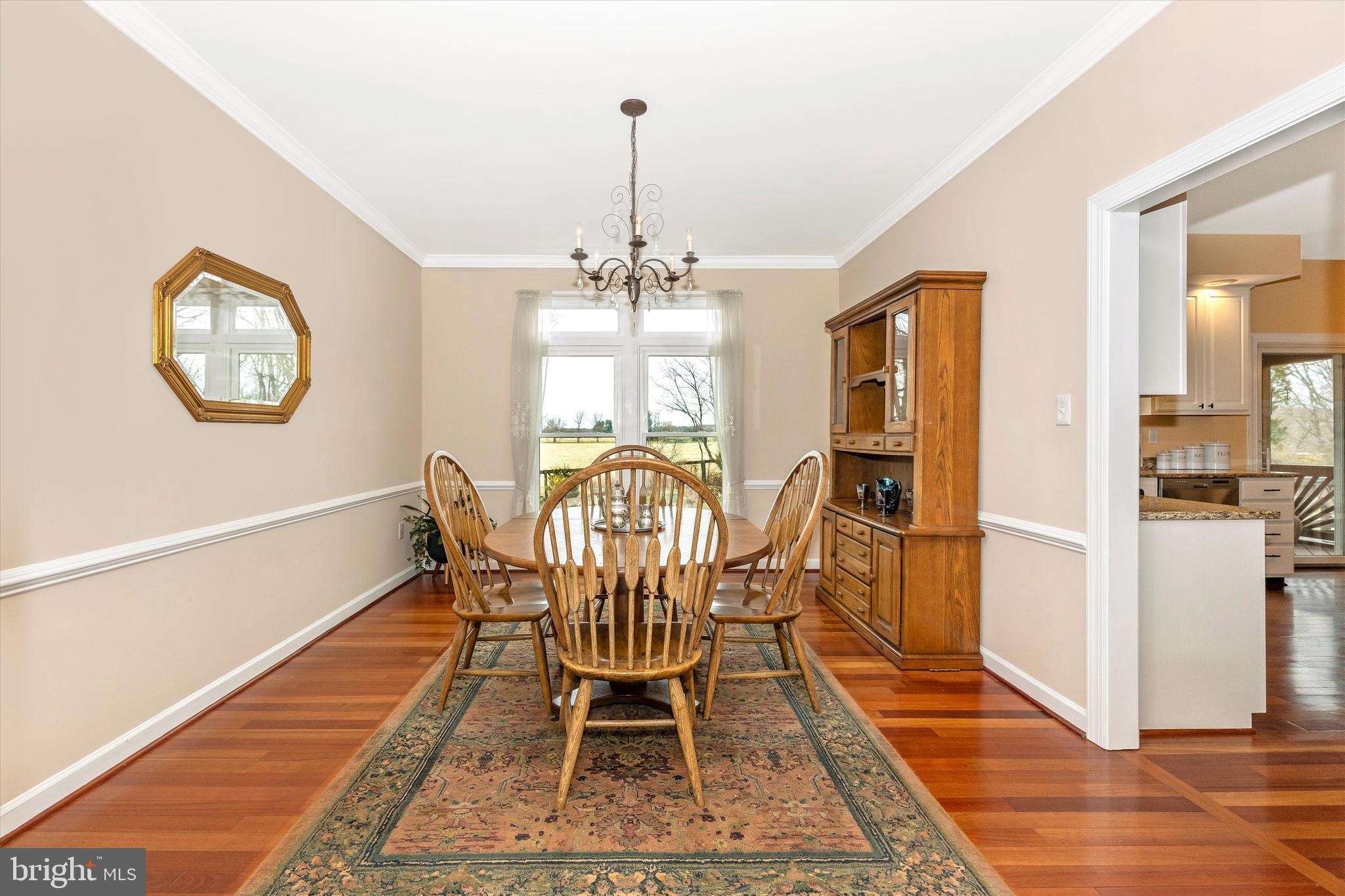 17918 Hickman Street Poolesville, MD 20837 - Photo 8 of 96 a view of a dining room with furniture window and wooden floor