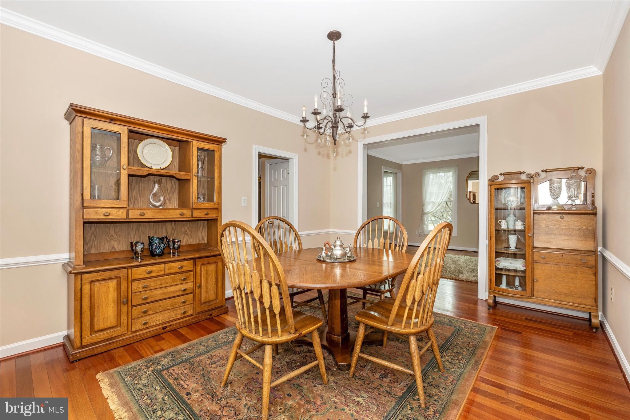 17918 Hickman Street Poolesville, MD 20837 - Photo 9 of 96 a view of a dining room with furniture and wooden floor