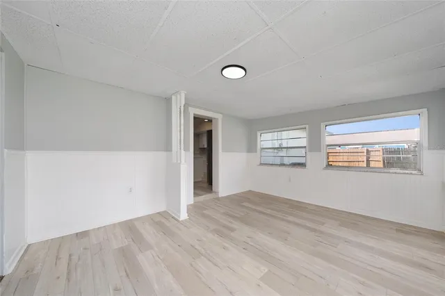 a view of an empty room with a window