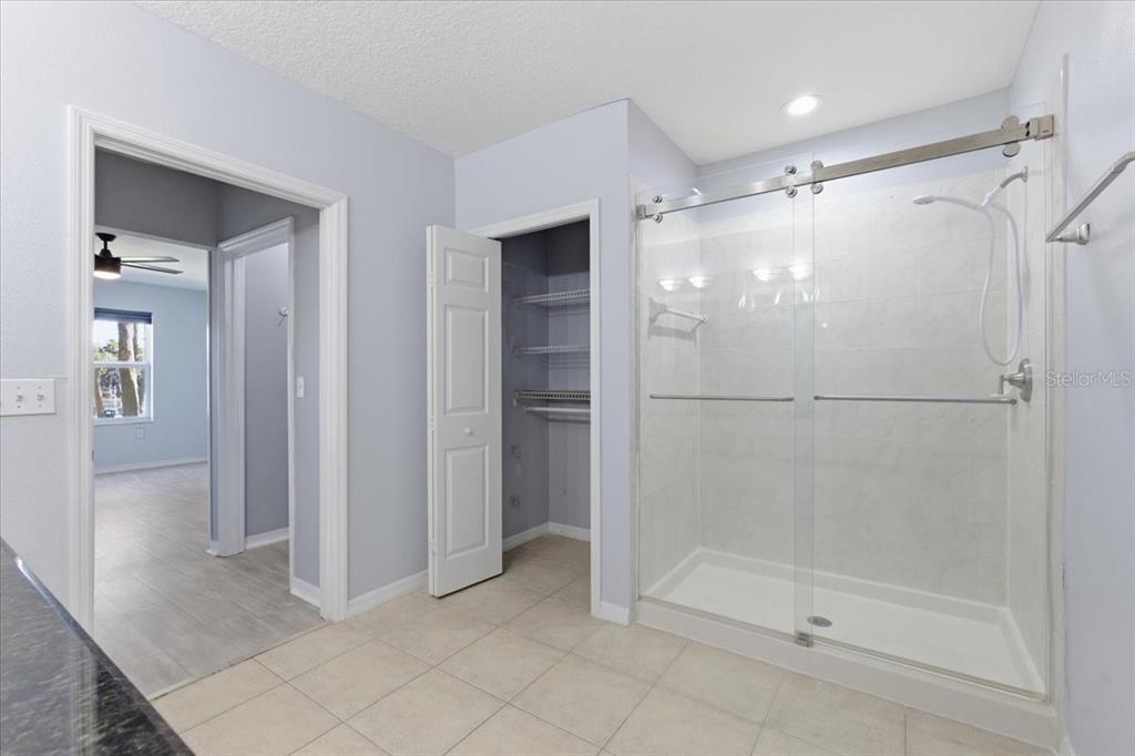 100 Canopy Walk Lane, Unit 112 Palm Coast, FL 32137 - Photo 25 of 62 a bathroom with a glass shower door