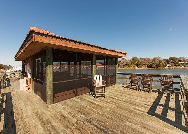 100 Canopy Walk Lane, Unit 112 Palm Coast, FL 32137 - Photo 42 of 62 a view of a roof deck with chair and wooden floor