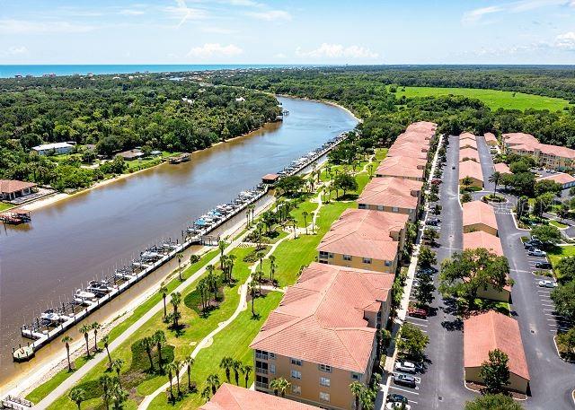 100 Canopy Walk Lane, Unit 112 Palm Coast, FL 32137 - Photo 50 of 62 an aerial view of a city with a lake view