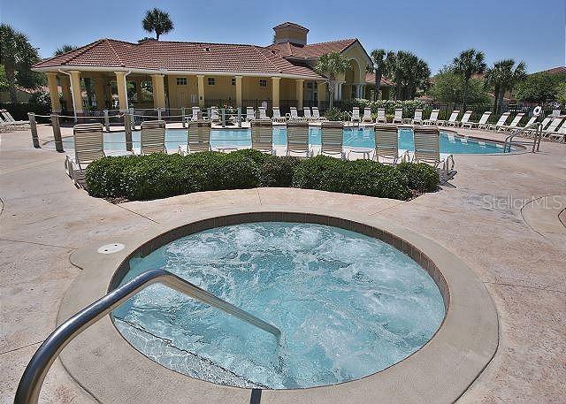 100 Canopy Walk Lane, Unit 112 Palm Coast, FL 32137 - Photo 51 of 62 a view of a house with a swimming pool