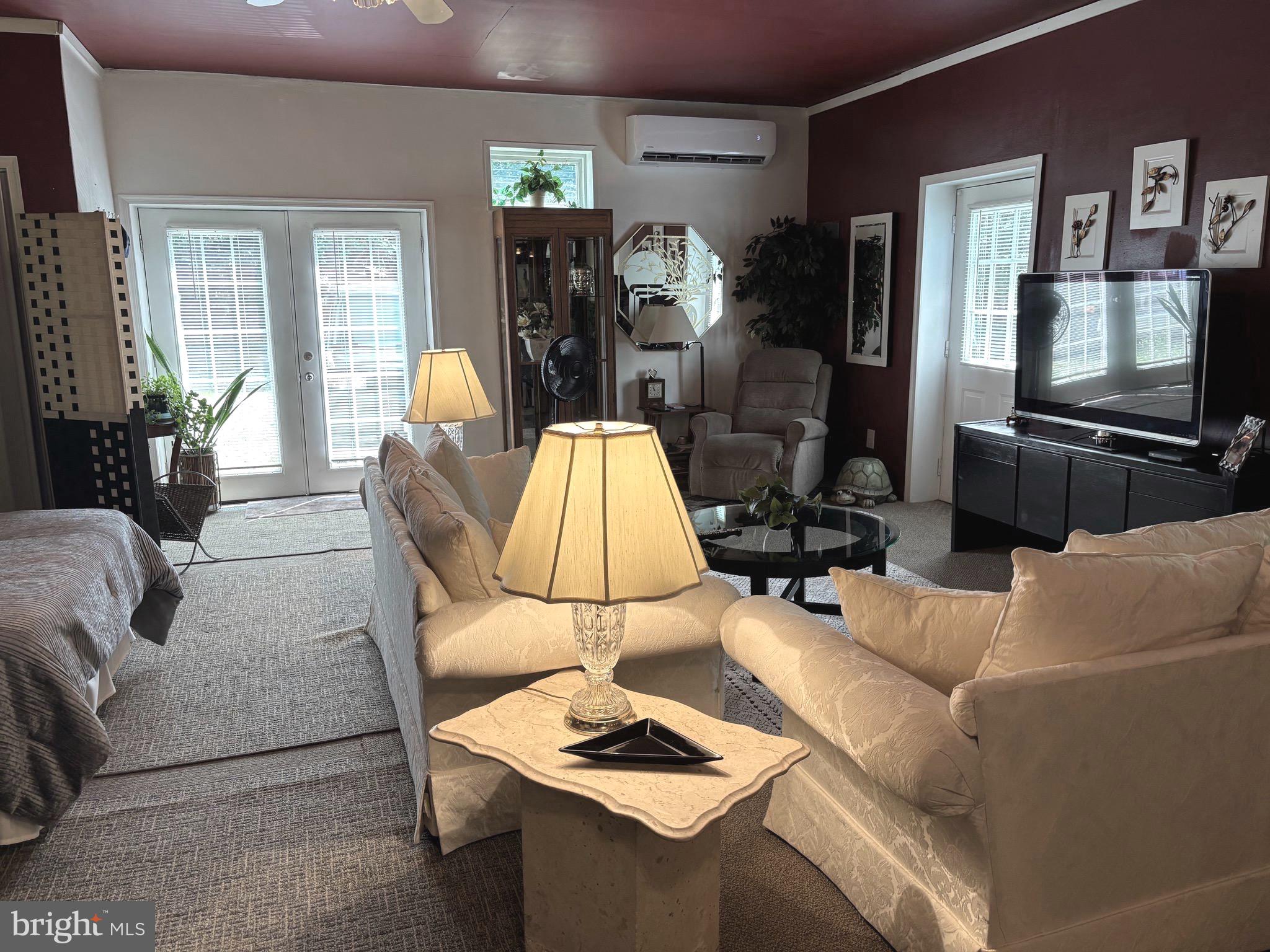 579 Leeland Road Fredericksburg, VA 22405 - Photo 9 of 20 a living room with furniture and a flat screen tv